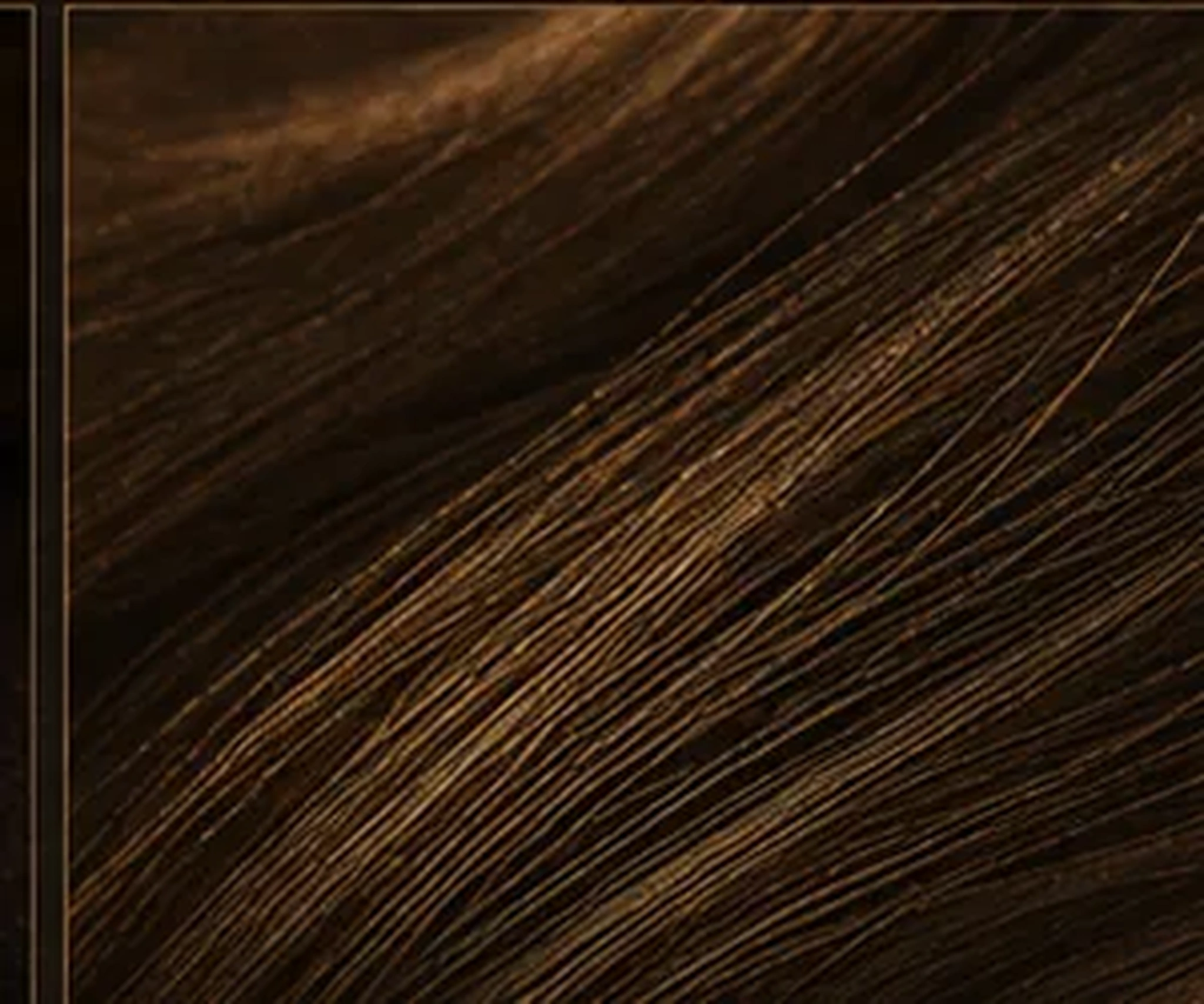 Close view of fine metallic filaments catching warm light
